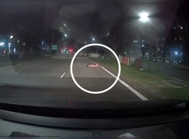 naked_man_lying_on_road_singapore